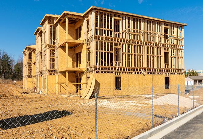 a temporary chain link fence winding around a construction site, outlining the project's progress in Franklin, OH